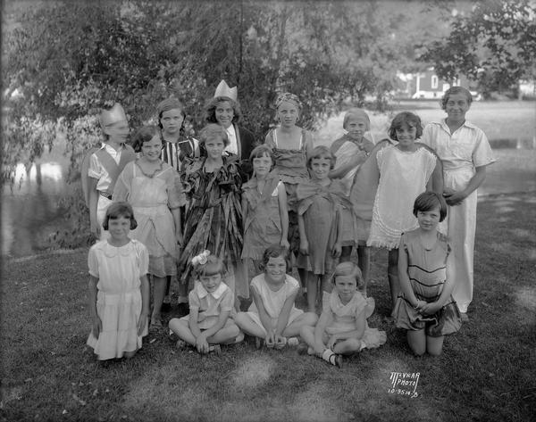 Marquette School children, with their drama teacher Ethel Kaump, in costumes for their play "The Fairy Woods," presented on the banks of the Yahara River.