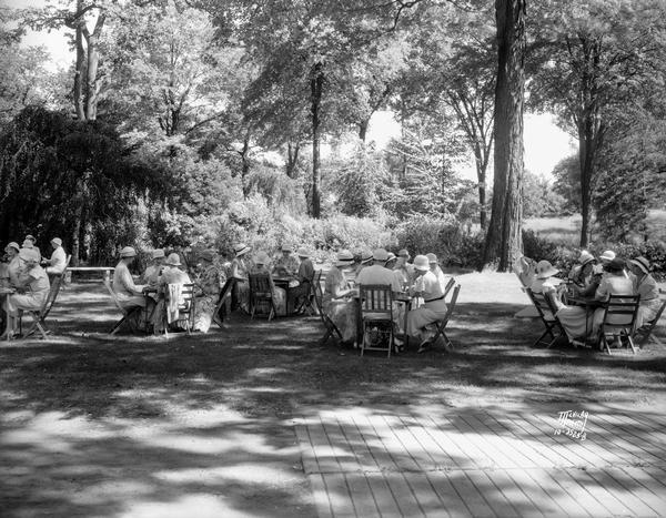 A.A.U.W. women play bridge in the garden of Mrs. Carl A. Johnson's house, Fuller's Woods.