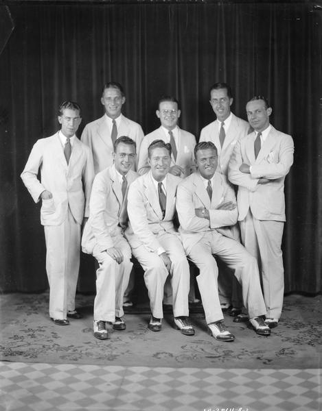 Group portrait of Chanticleer "Lanky Neal" Orchestra dressed in identical suits and two-tone shoes.