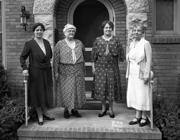 Group portrait of female officers in Wimodaughsis Club, wives,  daughters and sisters of master Masons. Right to left?: President, Maude M. West; vice-president, Mattie J. Neitert; secretary, Elizabeth Hancock; and treasurer, Ellen Johnson.