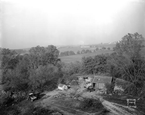 Elevated view of a colony of squatters in Sunset Point (Hoyt Park, Quarry Park), former quarry site. Home of John & Lottie Corcoran from 1924-1994.