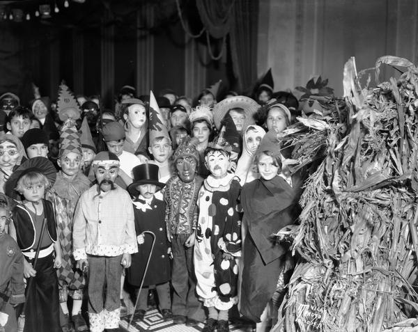 Children posing in Halloween costumes at The Capital Times-RKO Strand Theatre Halloween party.