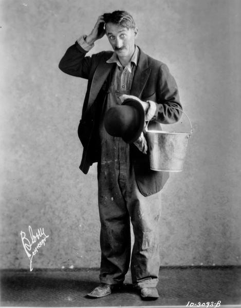 Copy photograph of Actor Clyde Cook in costume, for the RKO Orpheum Theatre, with a signature that reads "Blosey, Chicago."