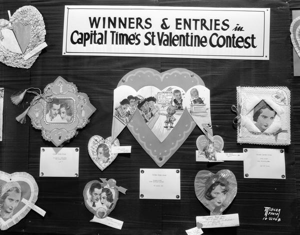 Winners and entries in "Capital Times" Valentine contest. The Valentine with the court scene in the center, featuring comic actors in "Ladies of the Jury," playing at the Orpheum Theatre, won first prize for Robert Koch.