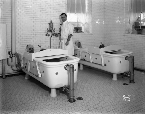 Military veterans receive therapy in hot water tubs, with George Gardner, director of the hydro-therapy department, Wisconsin Memorial Hospital on Farwell Point adjoining the Mendota Mental Health Hospital.