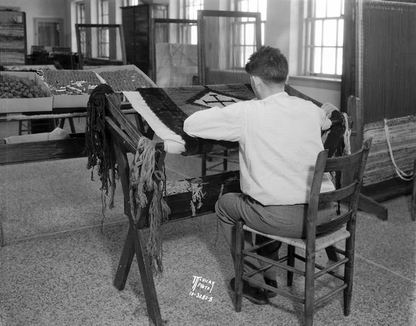 A military veteran learns rug weaving at Wisconsin Memorial Hospital on Farwell Point, adjoining Mendota Mental Health Hospital as part of his rehabilitation.