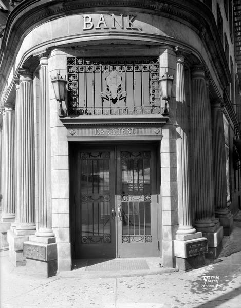 Corner entrance to the classically-columned Commercial National Bank, 102 State Street.