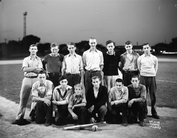 Group portrait of young men that play on a night baseball team at Breese Stevens Field.