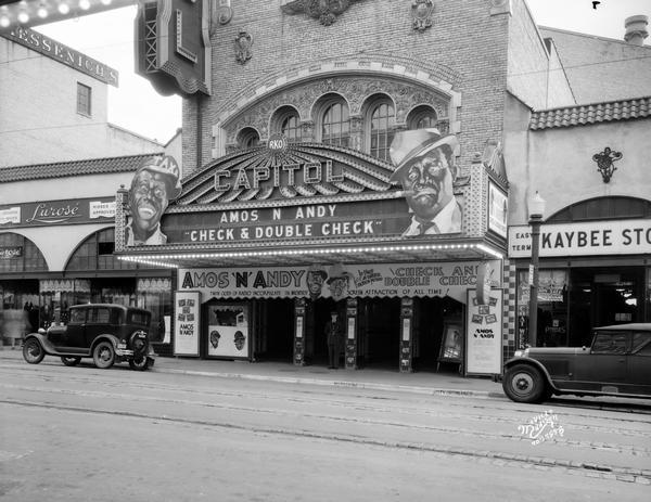 The Capitol Theatre marquee, 209 State Street, advertises Amos 'n Andy in "Check and Double Check" flanked by the Lurose' women's clothing store, 205 State Street, and the Kaybee clothing store, 213 State Street.