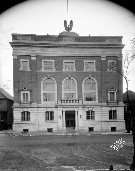 The classically-columned Fraternal Order of Eagles clubhouse, 23 W. Doty Street, with a sculpted eagle on the roof.