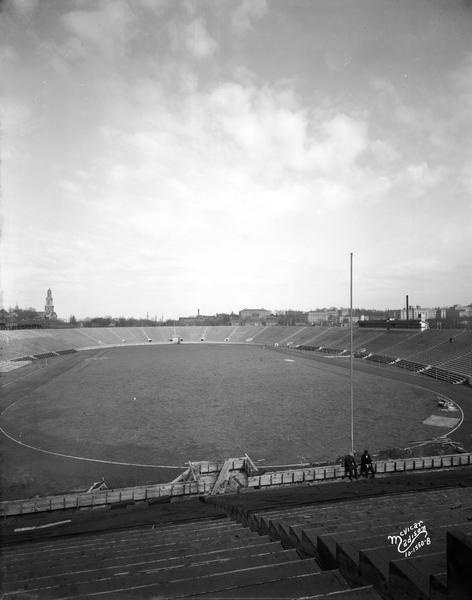 Camp Randall Field, viewed from the south bleachers, with the First Congregational Church and university buildings in the background.
