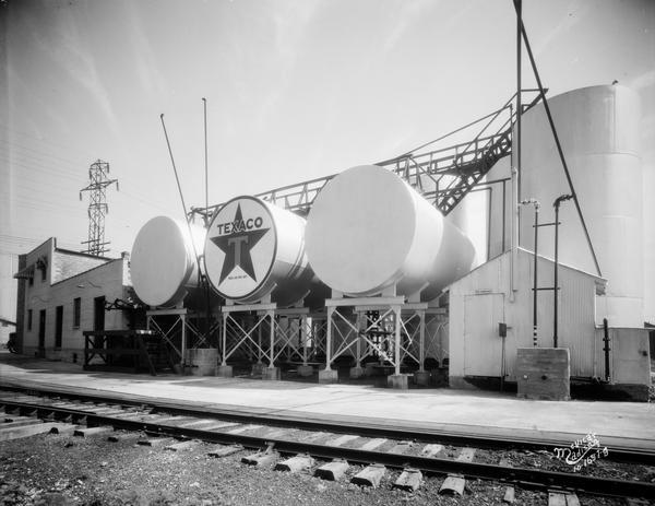View of a Texaco bulk station and storage tanks from across the railroad tracks at 919 E. Main Street.