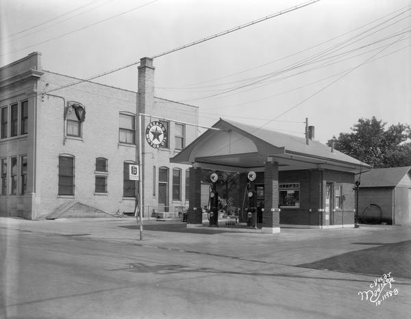 Texaco gasoline station with two gas pumps.