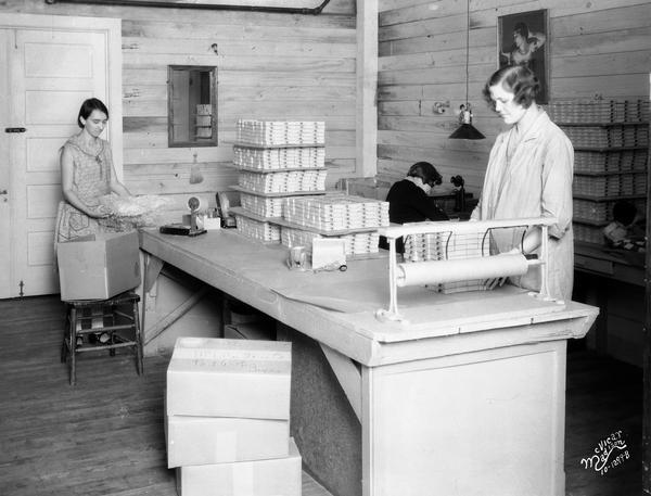 Women working in the packaging and shipping department of the Floralo Incense Company, located at 1212 Regent Street.