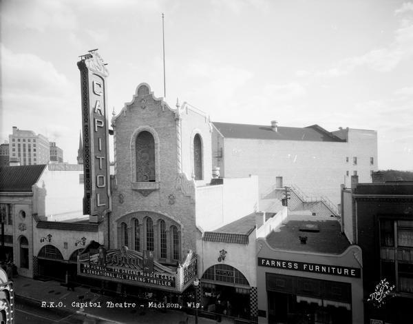 Elevated view of the 200 block of State Street, with the Capitol Theatre tower and marquee at 209 State Street, Kessenich's at 201 State Street, Fred W. Kruse Co. at 205 State Street, Peoples Clothing Company at 213 State Street, and Farness Furniture at 215 State Street.