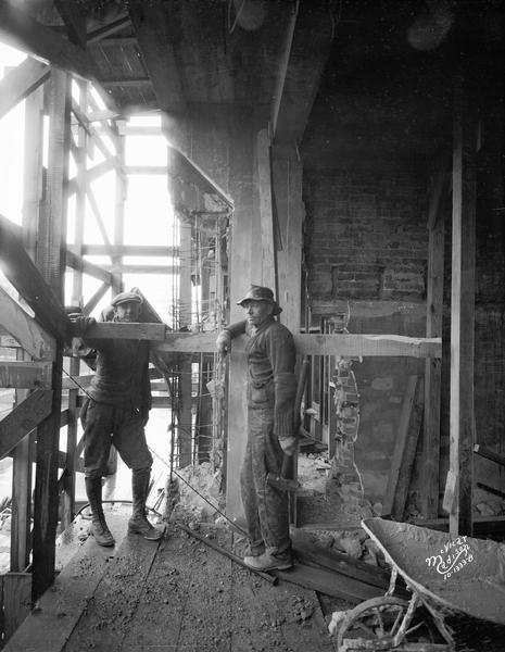 Workers posing on the balcony of the State Bank of Wisconsin addition under construction, 1 West Main Street.