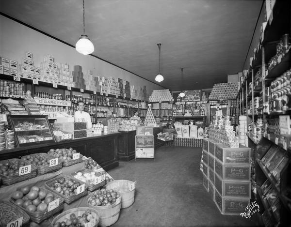 A & P store interior, 809 University Avenue. A person is standing behind the counter.
