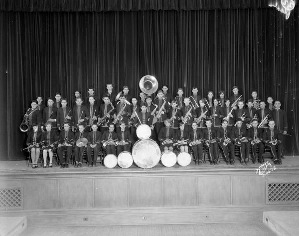 Members of the East High School band pose with their instruments for a group portrait.