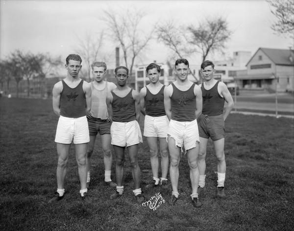 Outdoor group portrait of the Central High School male relay team.