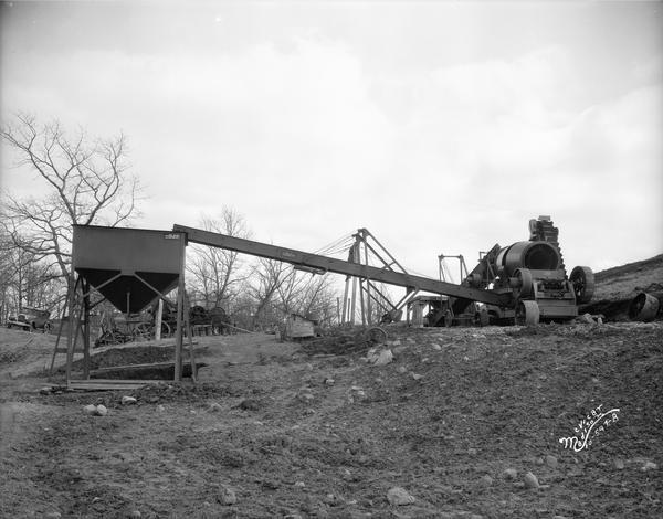 Crushing and loading machinery at a gravel pit.