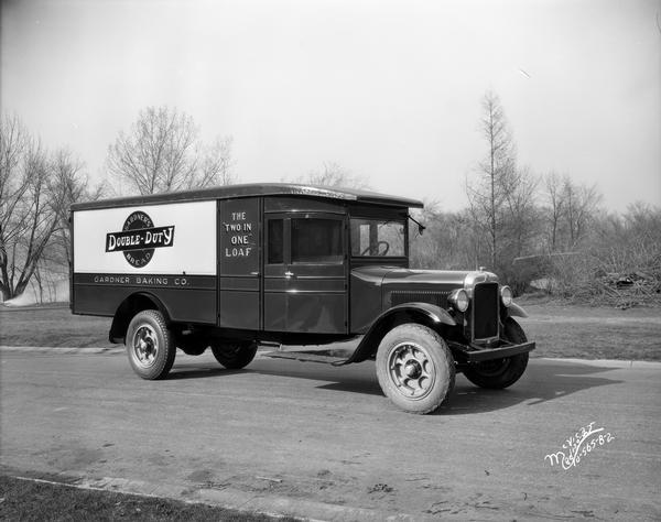Gardner Baking Company truck with "Gardner's Double-Duty Bread" and "The 'TWO IN ONE' Loaf" signs.