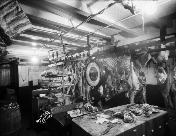 Madison Packing Company interior showing animal carcasses and Toledo Scale.