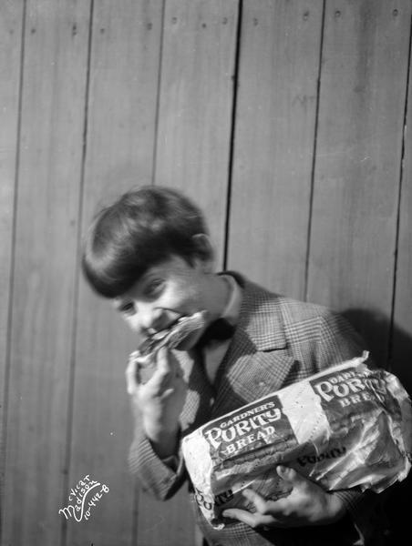Jackie Hooray eating Purity Bread.