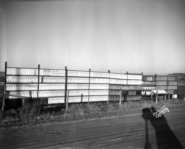Paint test panels near Middleton, with shadow of photographer and camera.