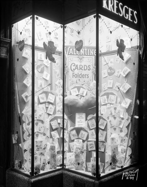 Kresge $1.00 Store, located at 13 South Pinckney Street, with a window display of Valentine cards and folders.
