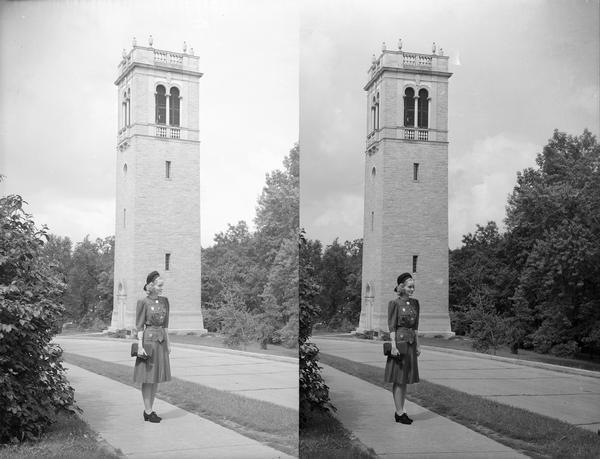 Manchester's Department Store model modeling a dress, hat, and purse in front of the Carillon Tower on the University of Wisconsin-Madison campus.