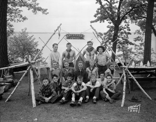 Group portrait of Boy Scouts, Troop #24, Explorer Post from Nichols School, at Four Lakes Council Camporee in Olin Park with Lake Monona in the background.