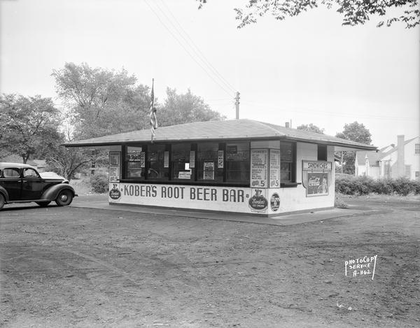 Kober's Root Beer and Ice Cream Bar, 2237 Sherman Avenue, with menu displayed on exterior and Coca-Cola, Borden's Ice Cream and Hires Root Beer signs.