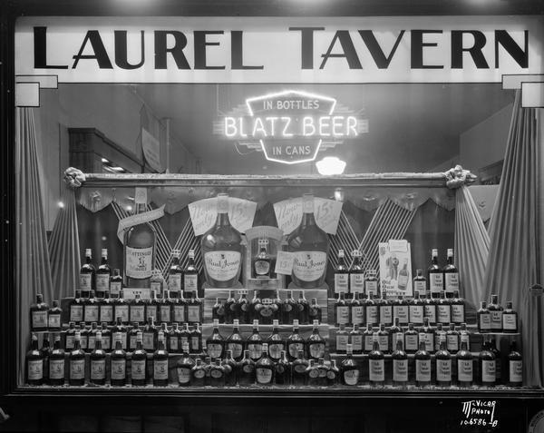 Display window of Paul Jones liquor and Blatz Beer neon sign at the Laurel Tavern, located at 2505 Monroe Street.