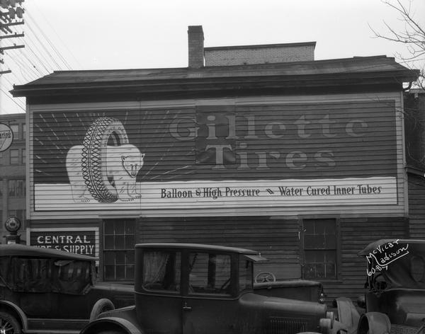 Gillette tire sign painted on the side of the Central Tire and Supply building in Madison.  Gillette tires were manufactured in Eau Claire, Wisconsin, and the sign depicts their "bear for wear" slogan.