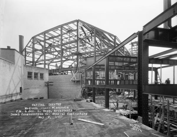 Side view from the roof of Kruse's store, towards the Capitol Theatre under construction, of steel frame of structure.
