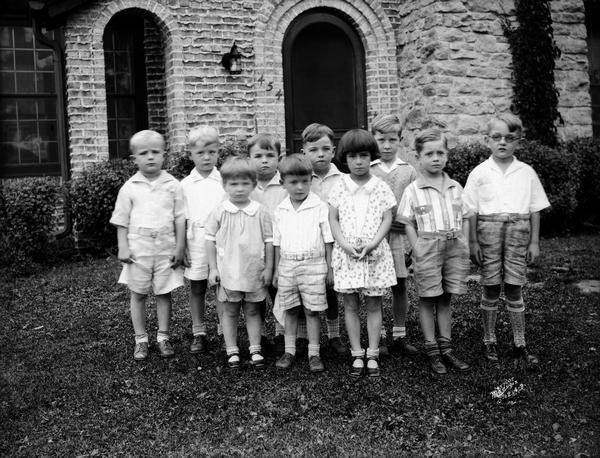 Portrait of ten children at birthday party. Taken for Mrs. Mark Cullen, 454 Virginia Terrace.