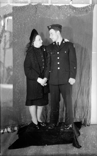Herbert Bisno, of Tripp Hall, in United States ROTC uniform, with his mother Mrs. L. Bisno, of Montclair, New Jersey.
