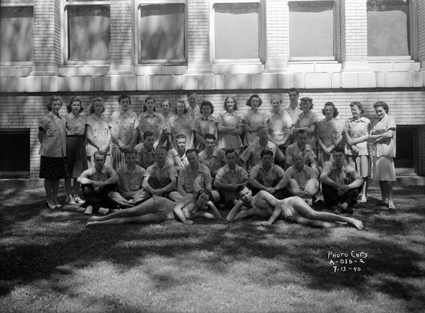 Group portrait of Madison Recreation Department group leaders and instructors in front of Lincoln School, located at 712 East Gorham Street.