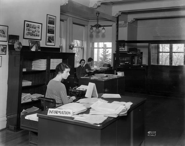 Three female employees in the CUNA (Credit Union National Association) general office. 142 E. Gilman Street.