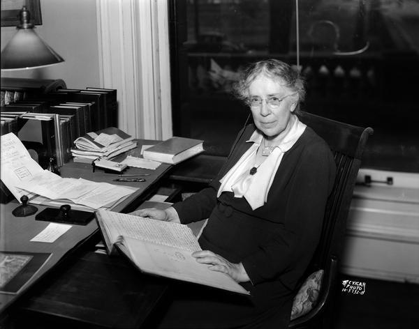Dr. Louise Phelps Kellogg sitting at her desk. Kellogg was an historian at the State Historical Society of Wisconsin.