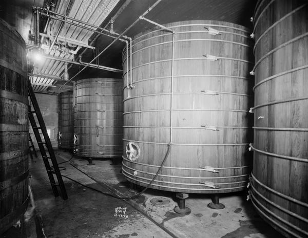 Five large wooden vats and two ladders in the Fauerbach Brewing Company second floor vat room.