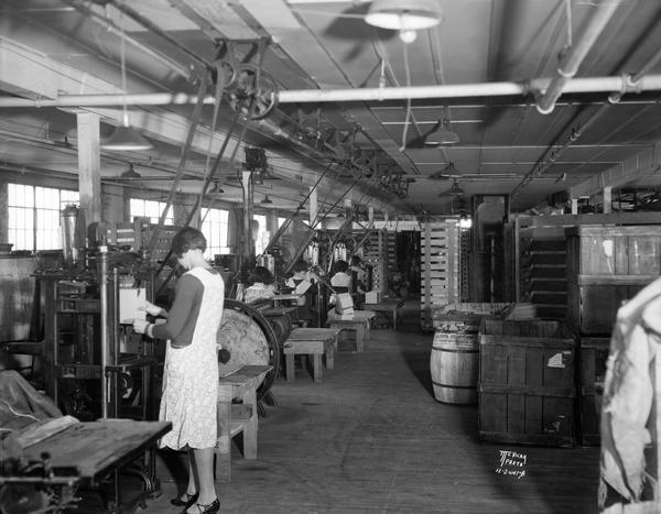 Interior Feldman Paper Box Company, 21-33 North Charter Street, with women at the machines.