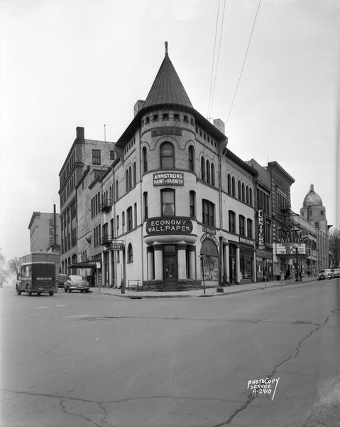 Economy Paint and Wall Paper Company, 125 King Street, corner of King Street and Doty Street, including Siekers Furniture, 119 King Street, the Majestic Theater, 115-117 King Street, and Capitol City Bank, 111 King Street.