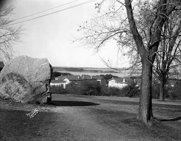 View from Observatory Hill of the new Men's Lakeshore dormitories at the University of Wisconsin-Madison, showing Chamberlin Rock in the foreground. The dormitories are Adams Hall, Tripp Hall and Carson Gulley Commons (originally called Van Hise Hall). Lake Mendota is in the far background.
