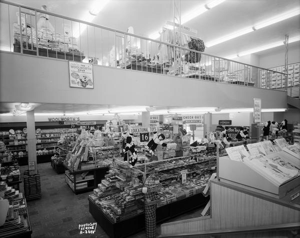 Interior of the new, self-service Woolworth's variety store, 2-8 West Mifflin Street, showing lower sales area and balcony at the back of the store with merchandise on display counters and shelves.
