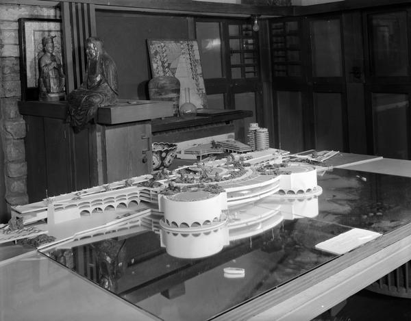 Model of proposed city auditorium (Monona Terrace) taken inside Frank Lloyd Wright's Taliesin Studio. The view is from above showing the roof top terrace.
