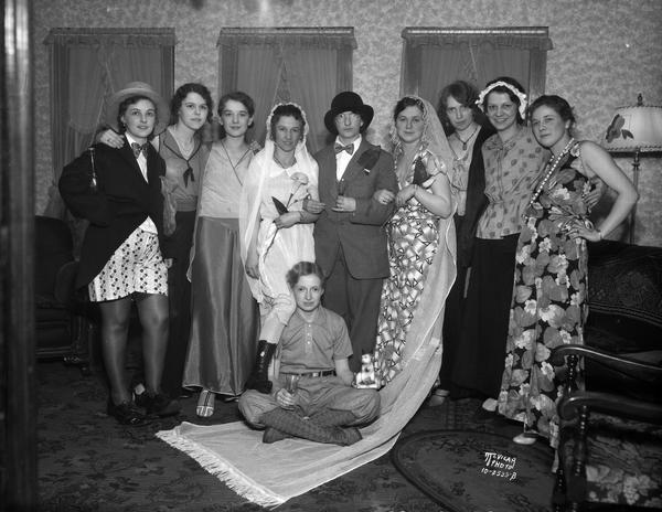 Ten women dressed in costumes for a party, 1401 Northern Court.