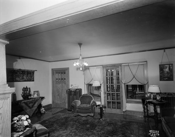 View of the living room and sun porch in E.G. Waste's house, from the dining room. The house was located at 1321 Jenifer Street.
