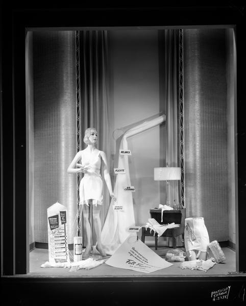 Show window at H.S. Manchester, Inc. department store, located at 2 East Mifflin Street. On display are La Resista corsets, including one mannequin.