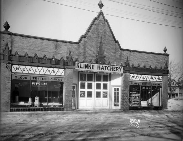 View of exterior of the Klinke Hatchery, 1918 Winnebago Street. There is a sign in the window for Vit-O-Ray poultry feeds.